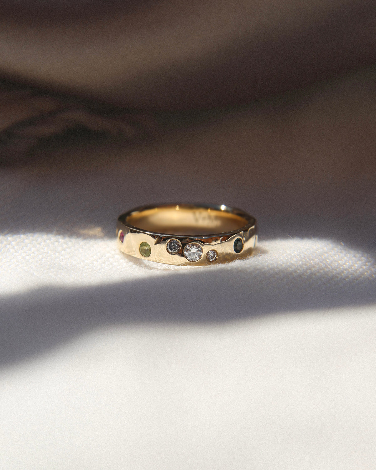 Gold ring with multiple precious stones and gemstones