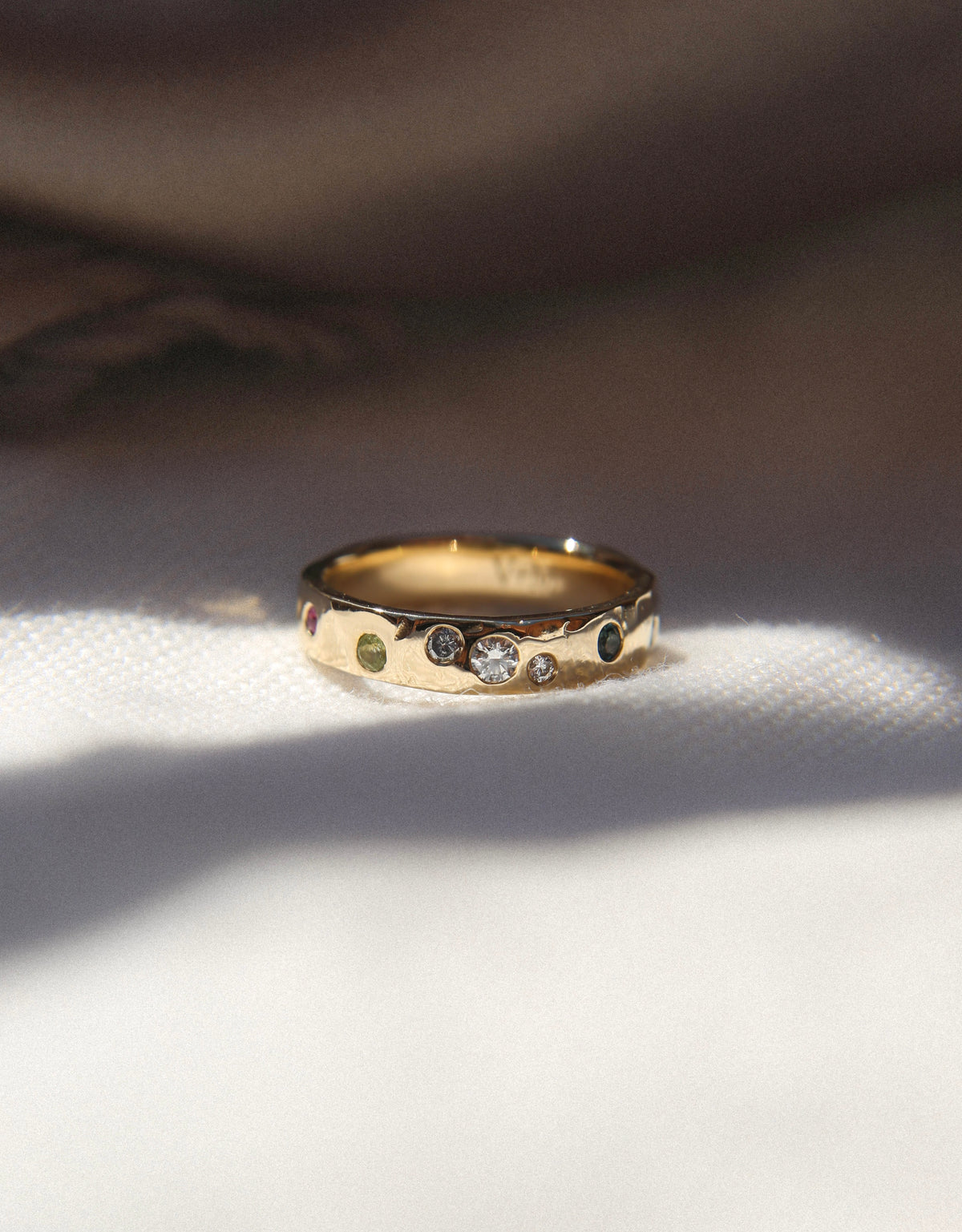 Gold ring with multiple precious stones and gemstones